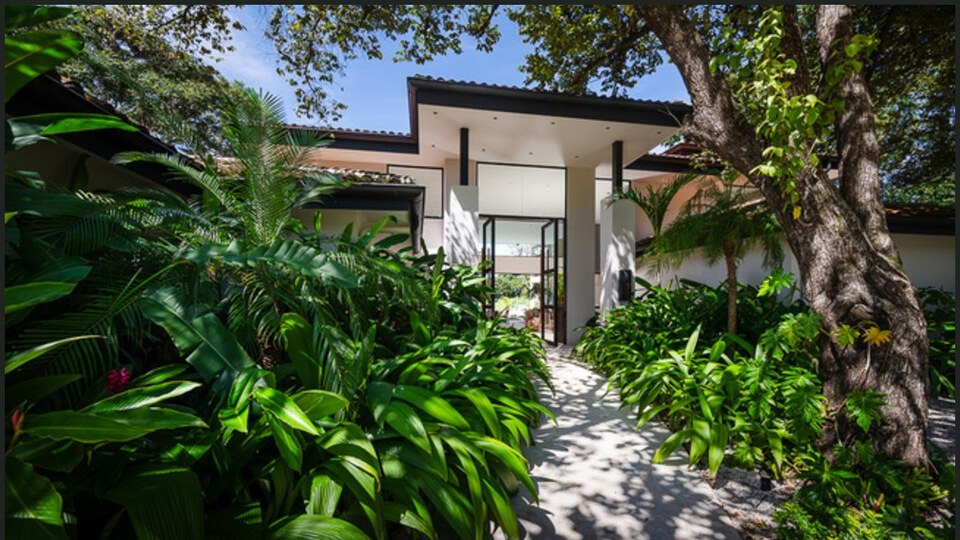 Lush garden entrance to the villa